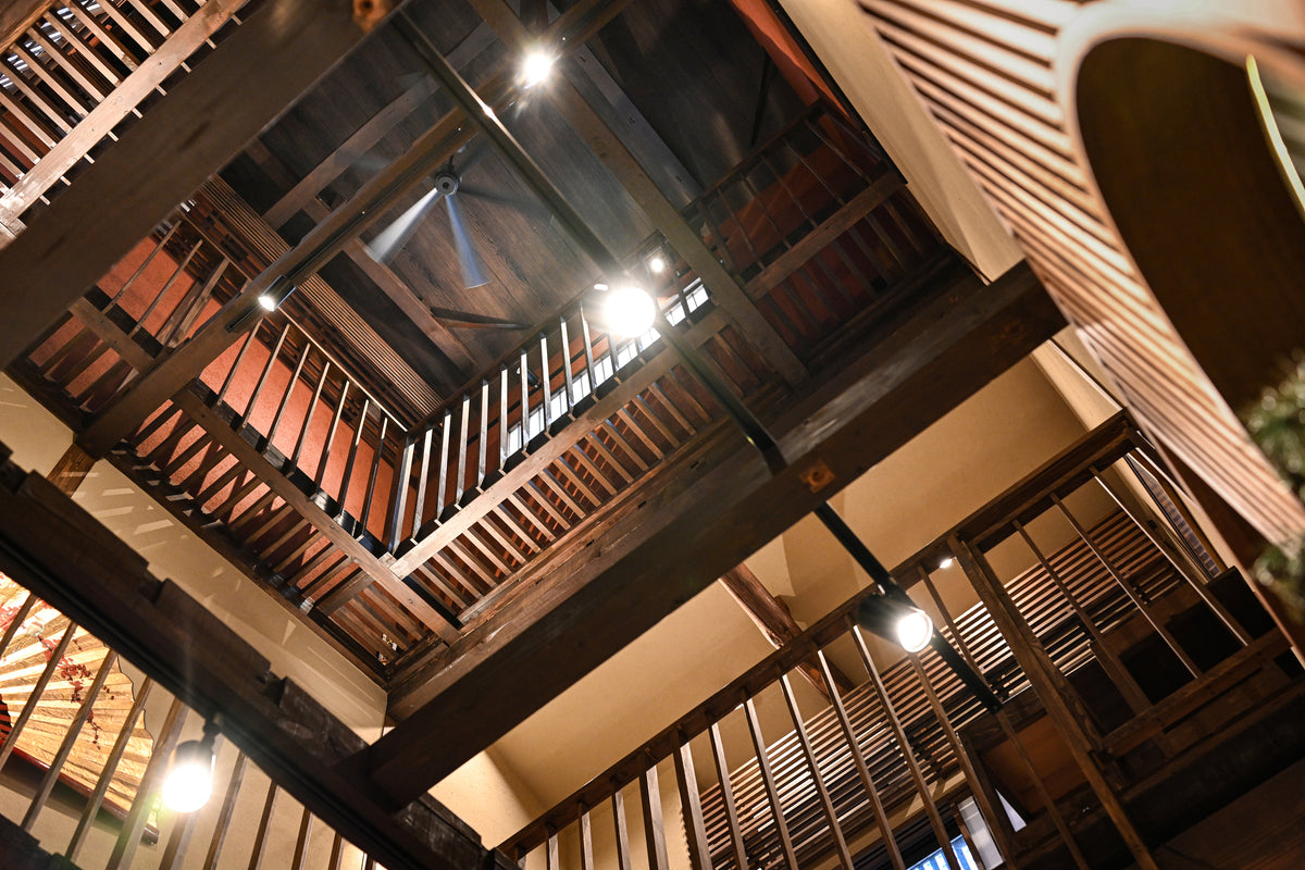 Original wooden beams and the open atrium of the restored boutique