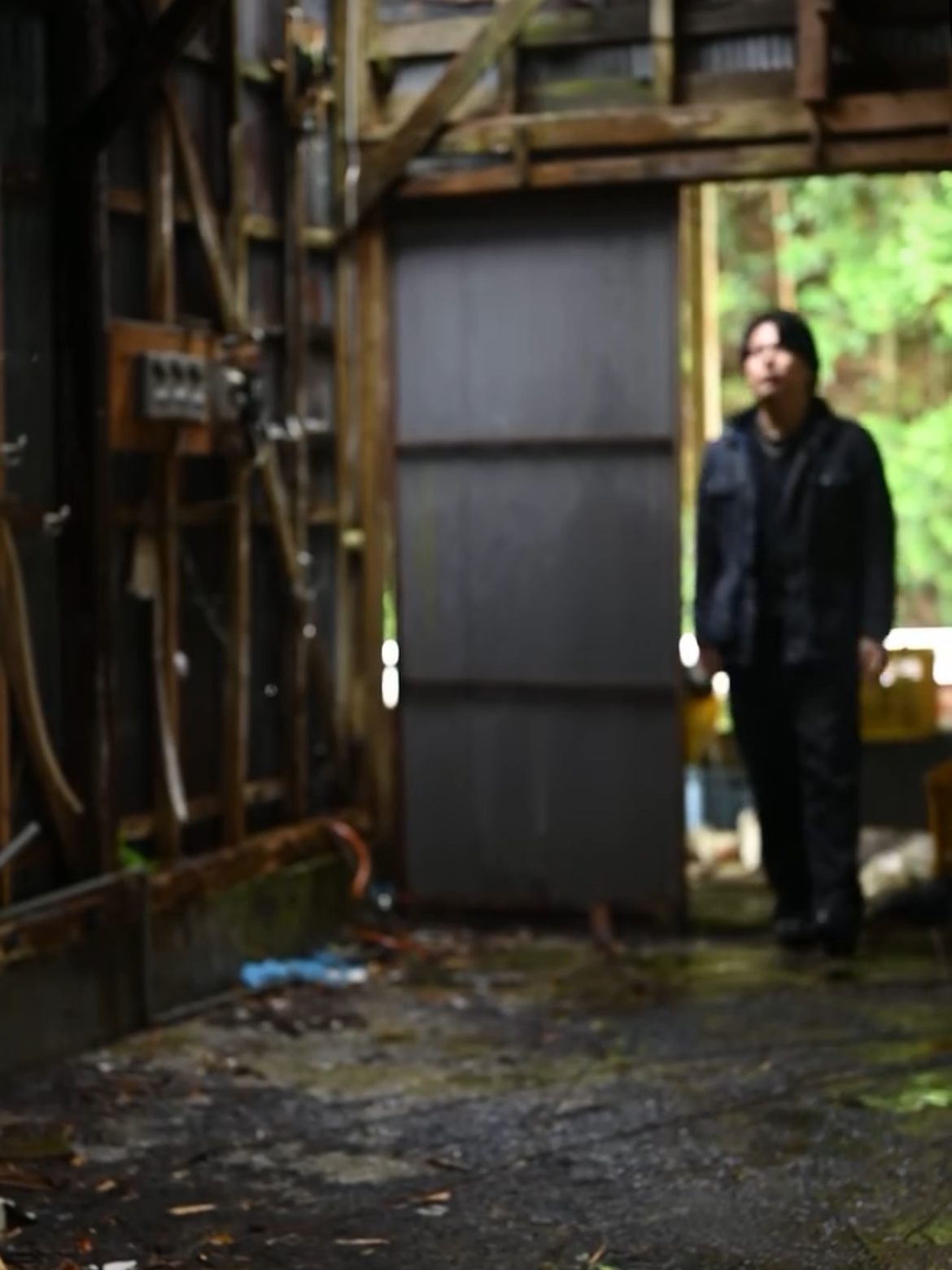 A person standing inside the old tea factory.
